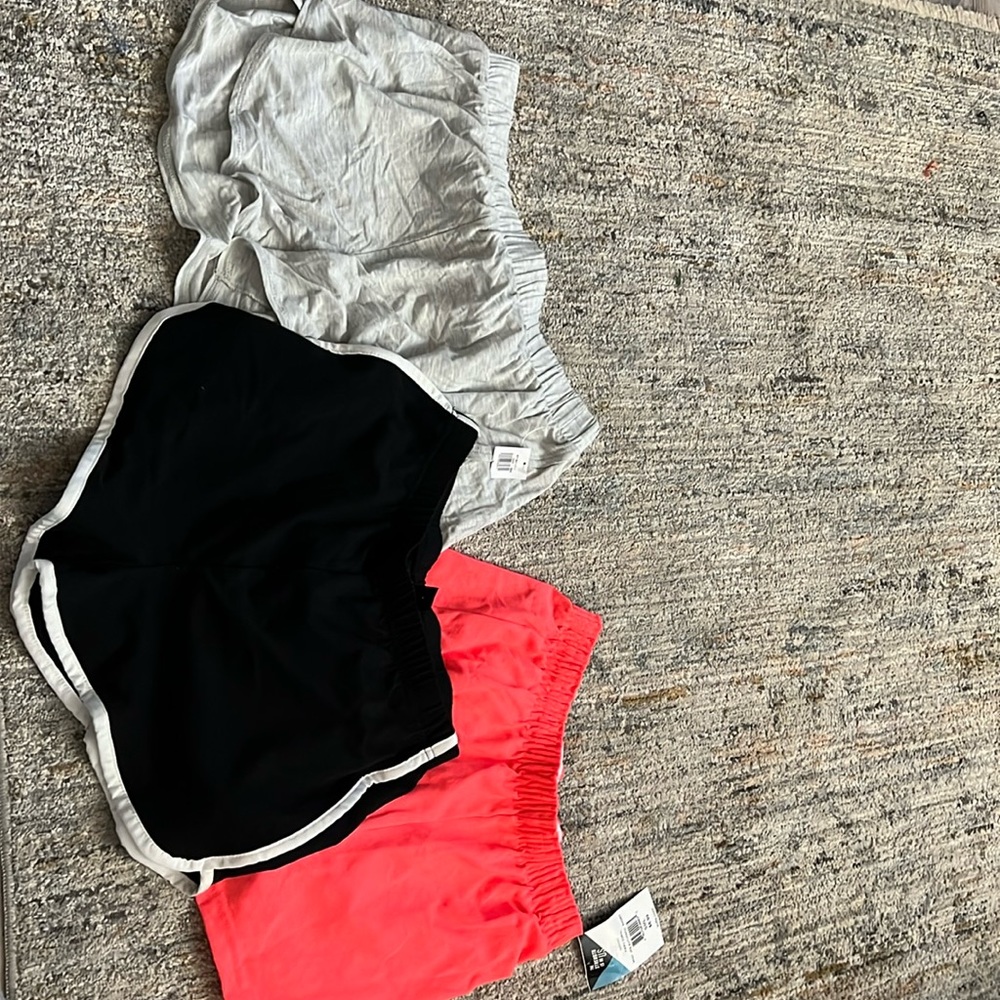 Three athletic gym shorts grey black and orange